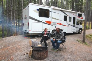 older couple outside their camper