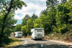 rvs driving along highway in summer
