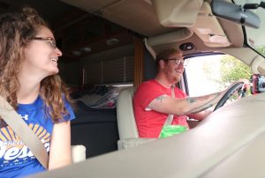 rv couple telling stories on road trip drive