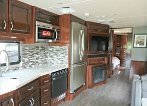 rv kitchen with a full sized fridge