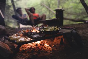 rv campfire cooking couple romantic