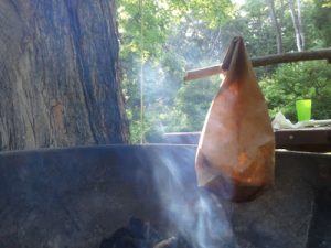 paper bag campfire cooking bacon and eggs breakfast
